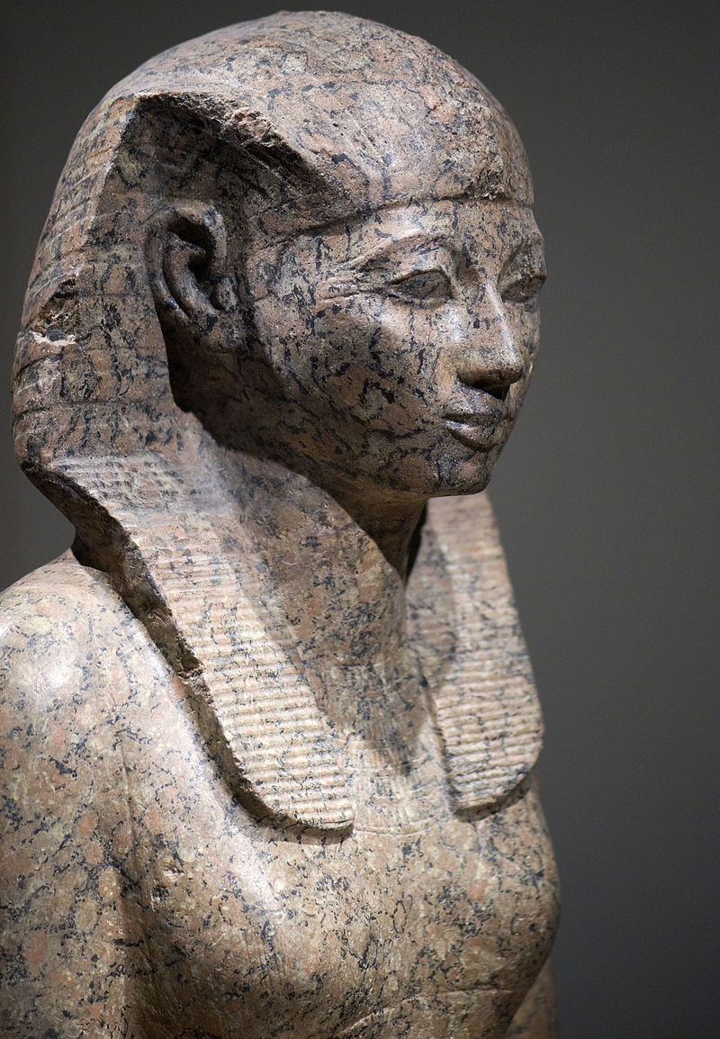 Stone statue of Hatshepsut showing her with the ceremonial false beard and male royal regalia