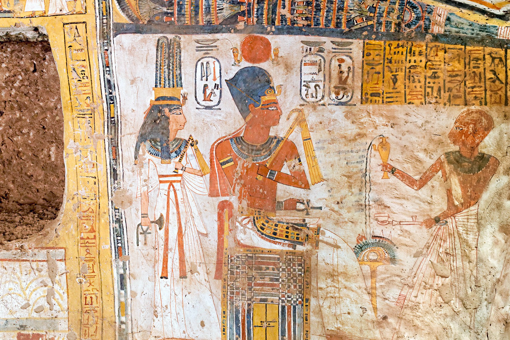 Priest Ameneminet presenting a libation offering to Pharaoh Amenhotep III and Queen Tiye in TT277
