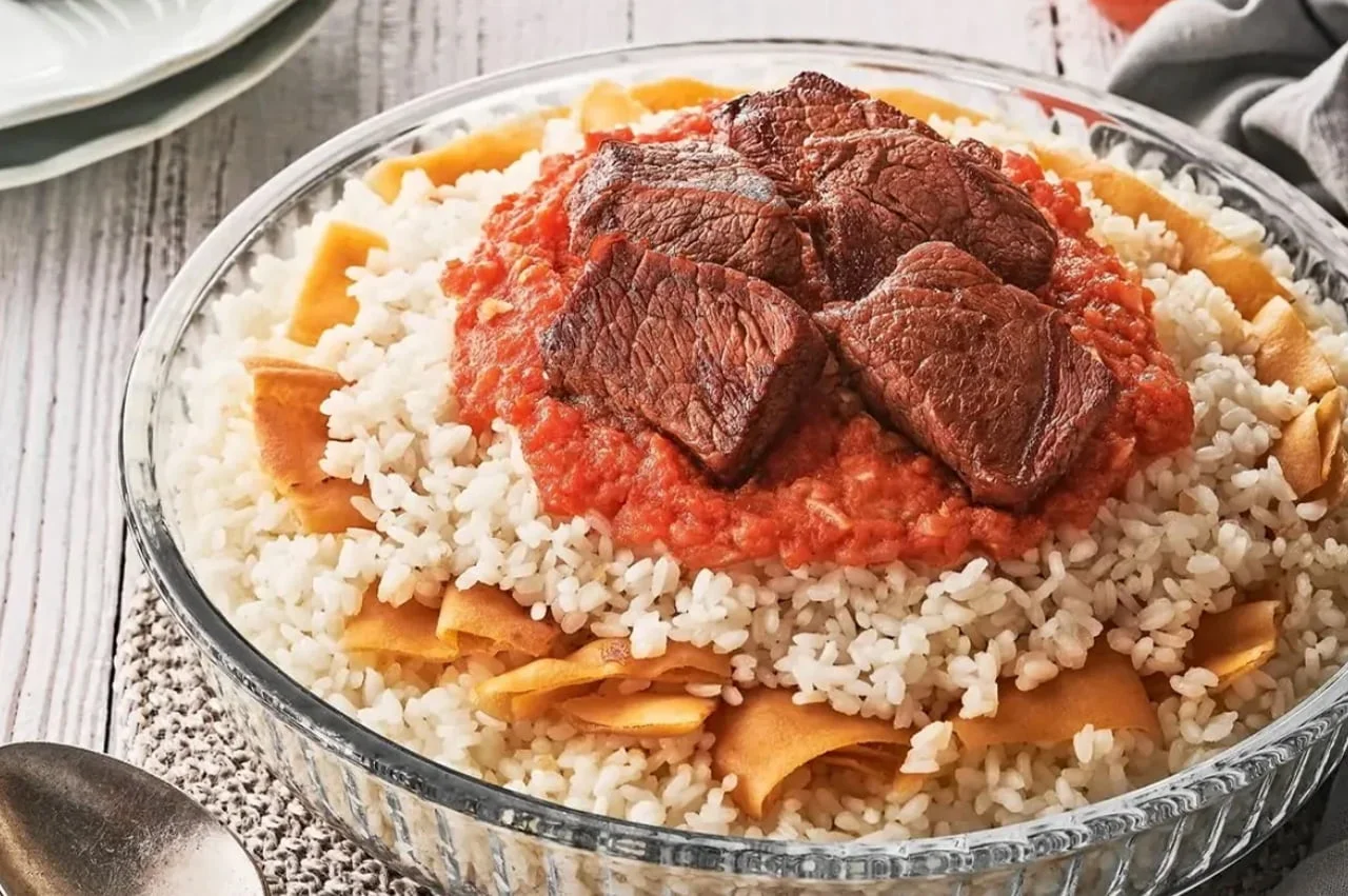 Egyptian Fattah, a layered dish of crispy bread, rice, slow-cooked meat, and sauces