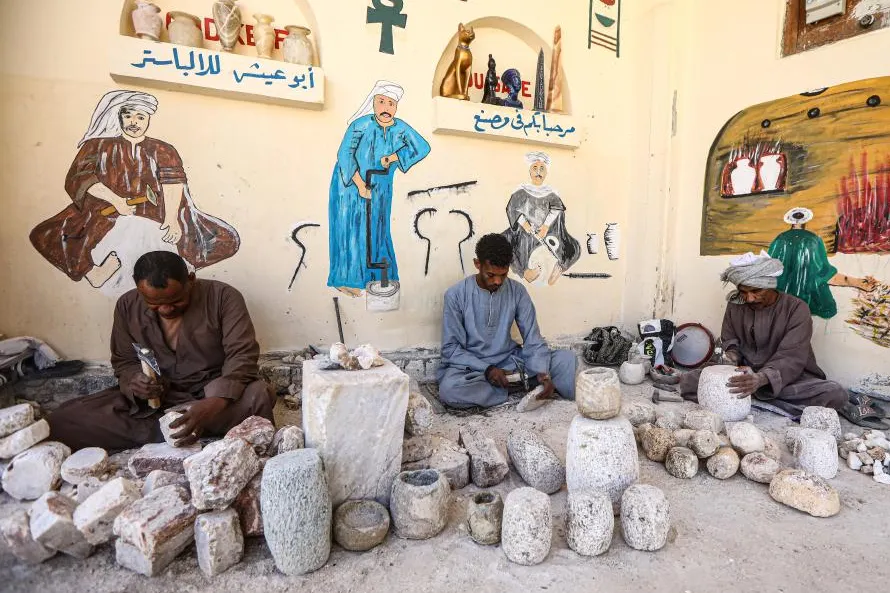 Artisan carving alabaster in a traditional West Bank workshop