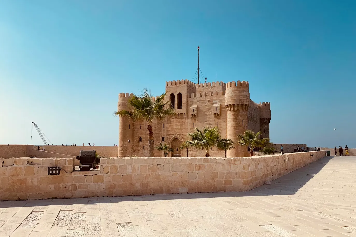 Sunset over the Mediterranean Sea with the Qaitbay Citadel in Alexandria