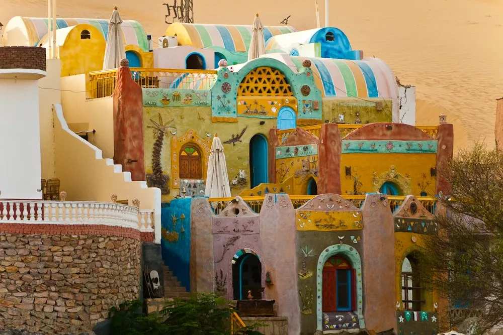 Colorfully painted Nubian village with traditional domed houses along the Nile